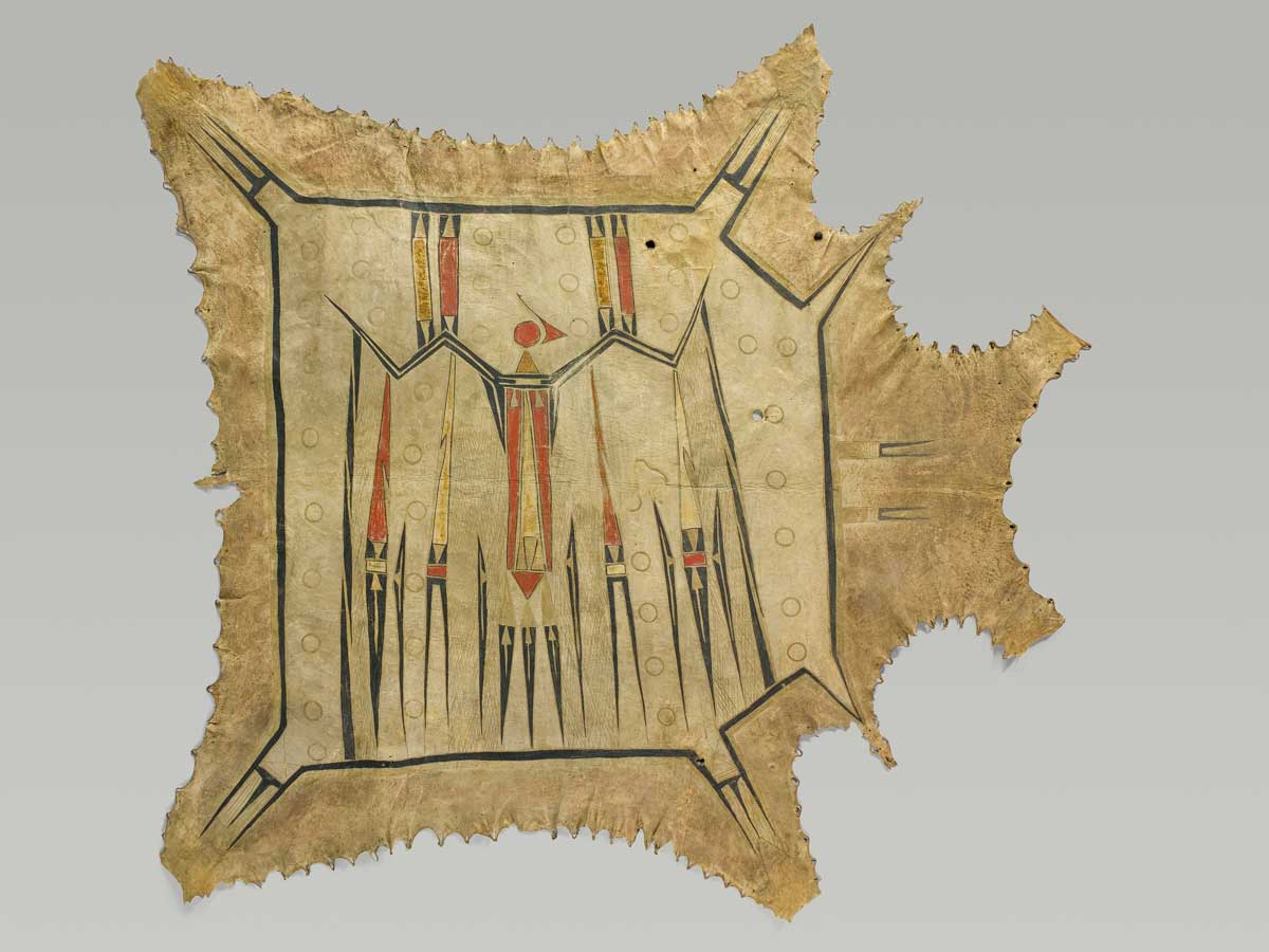 artwork titled ciinkwia minohsaya Painted Thunderbird Robe featuring a Native American design painted on bison or deer hide