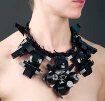 close-up of a modern art style necklace on a woman's neck
