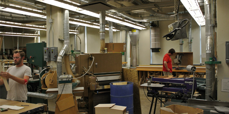 students working inside woodshop