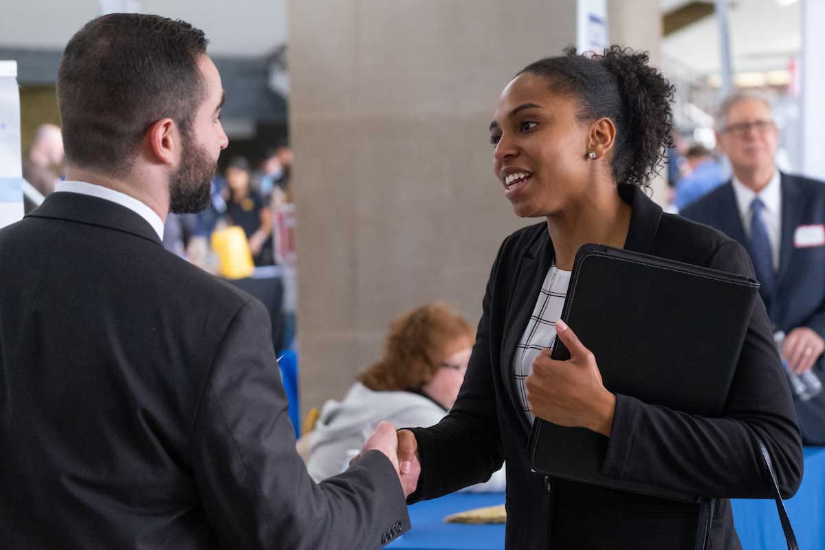 man and woman shaking hands