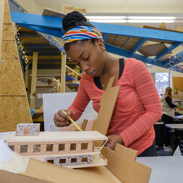 student working on a model