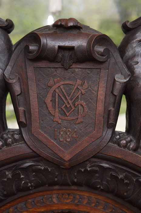 Alexander McGuffey Chair Upclose of Carved Emblem