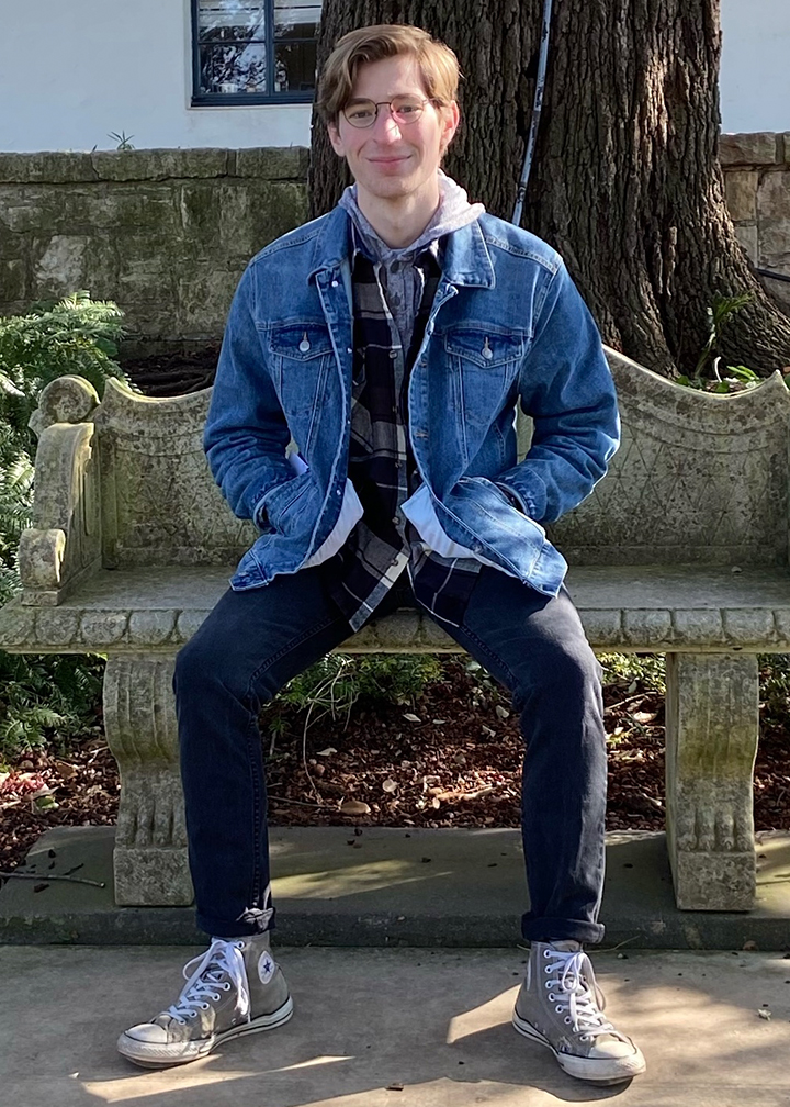 photo of Josh Senger sitting on a bench