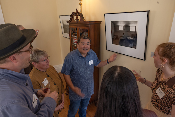 people looking at artwork