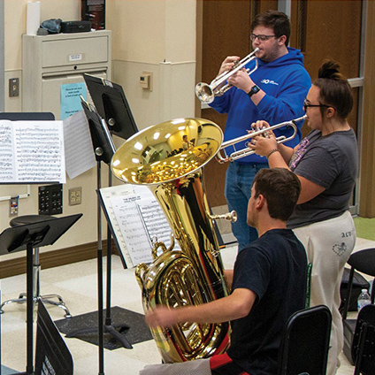 students playing brass instruments