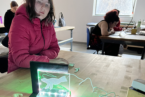 students looking at a project