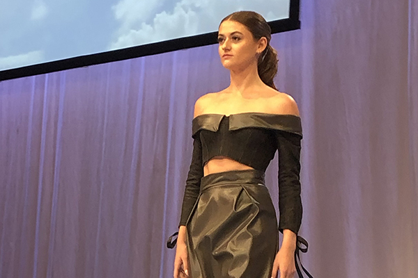 a student walking a runway