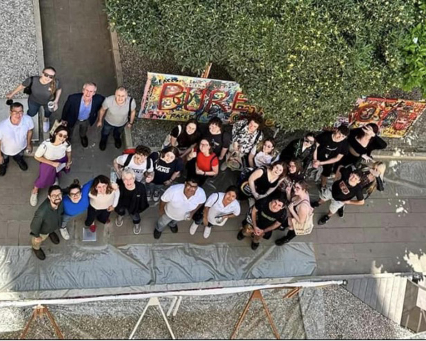 group of people with a painting