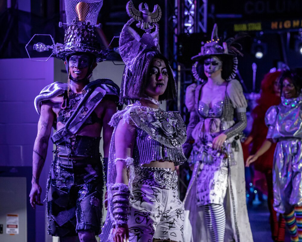 three people in elaborate costumes