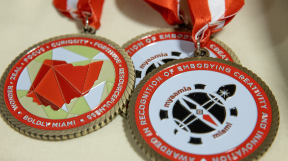 Miami University presidential medals with engraved wording: Awarded in recognition of embodying creativity and innovation.