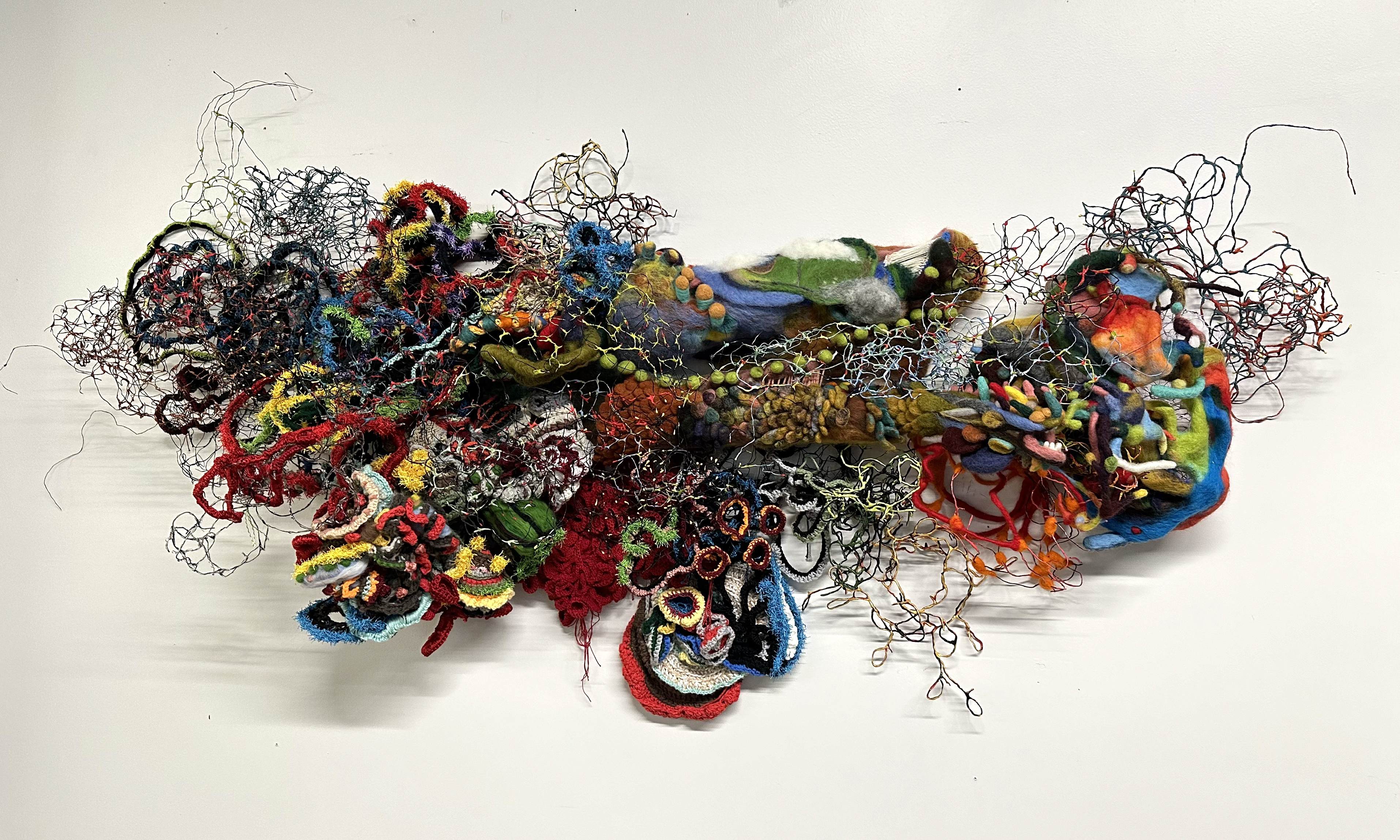 an art piece composed of various colors and fabric materials