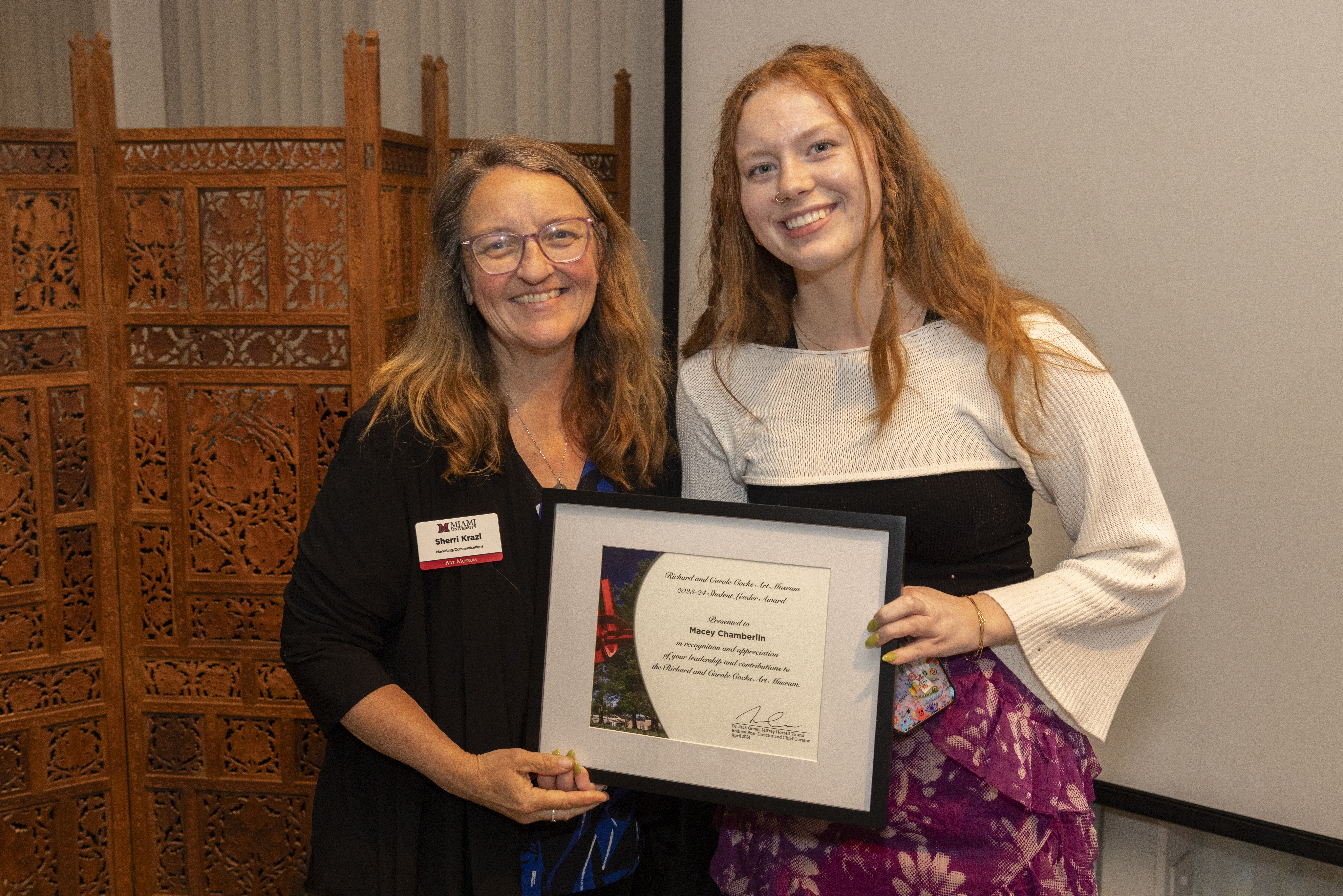 Macey Chamberlin is presented with her award by Sherri Krazl