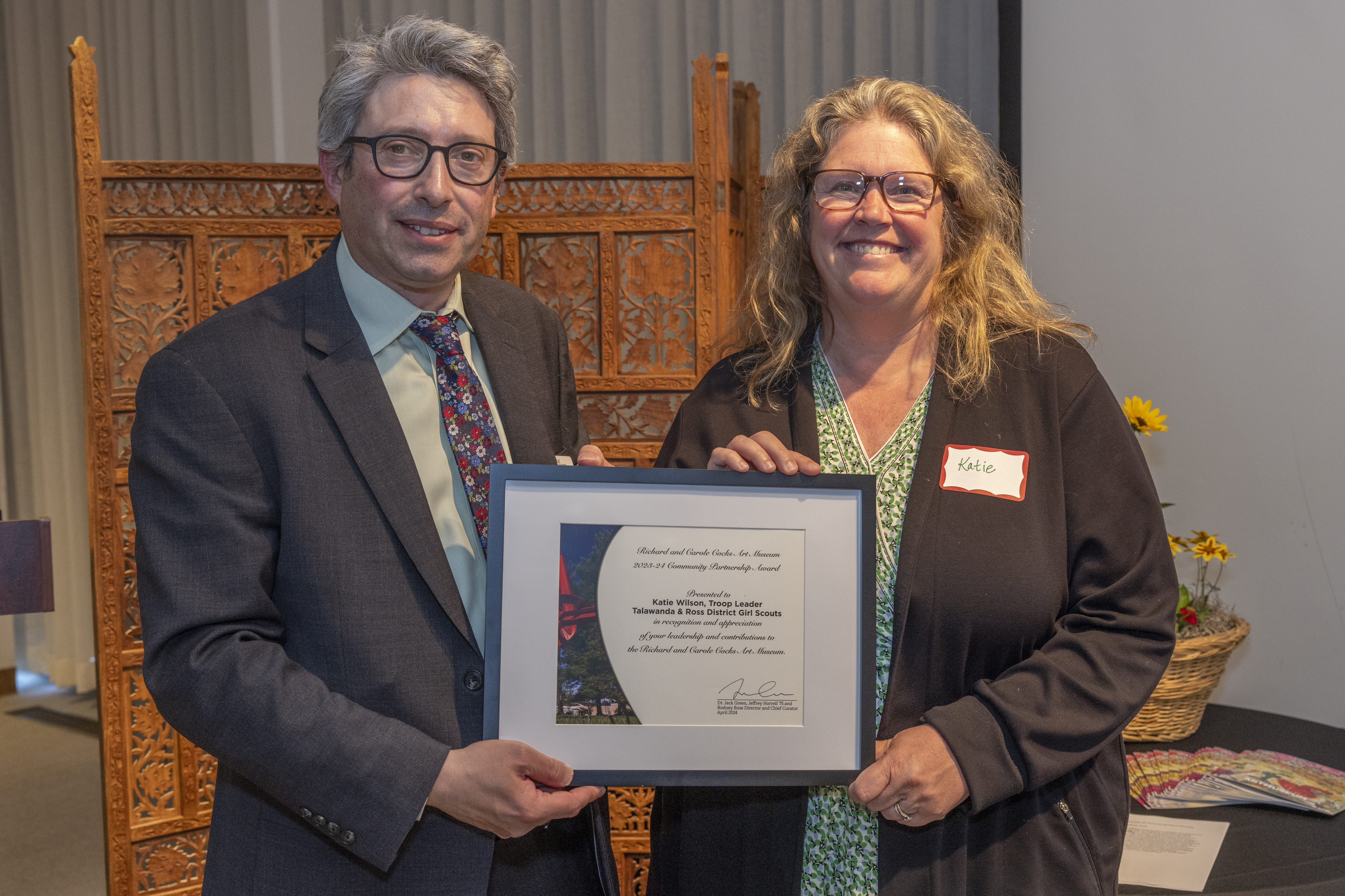 Katie Wilson receives the Community Partner Award from Jack Green
