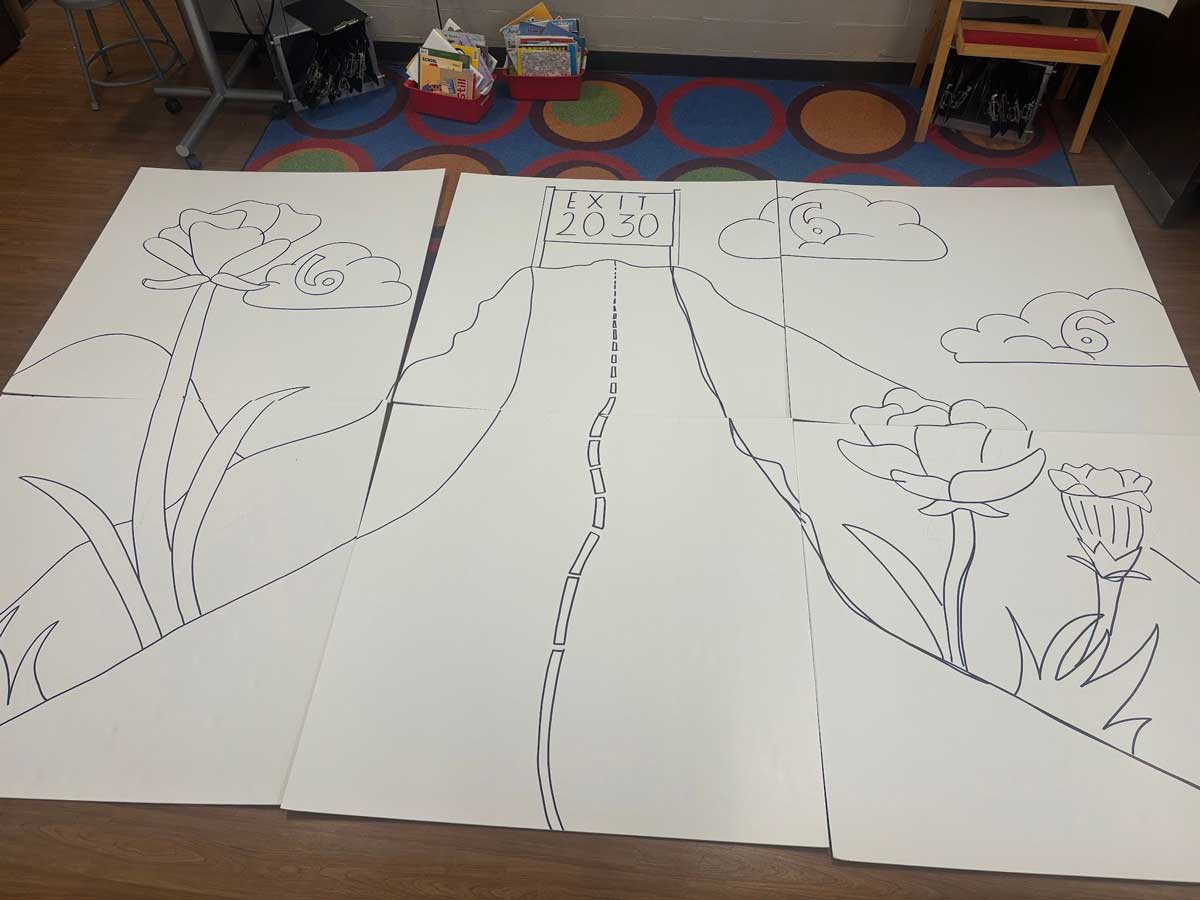 six panels placed together decorated with buttons creating a sketch depicting flowers along a road with clouds in the sky and a banner at the end of the road that says Exit 2030