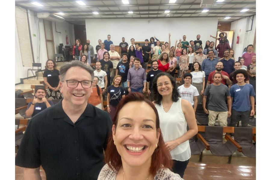Harvey Thurmer, Luciana Caixeta, and students