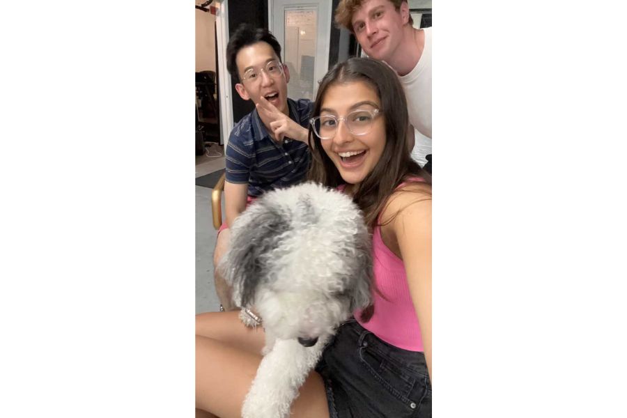 the Sparkli team with a white dog with gray ears