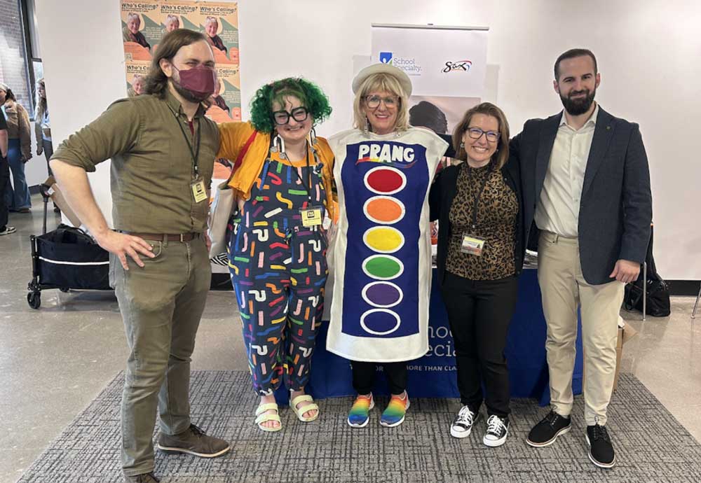 Dr. Luke Meeken, junior Isa Obradovich, Betsy Smith from Prang, Dr. Stephanie Danker, and Matthew Belsito from School Specialty pose for a photo during the conference.