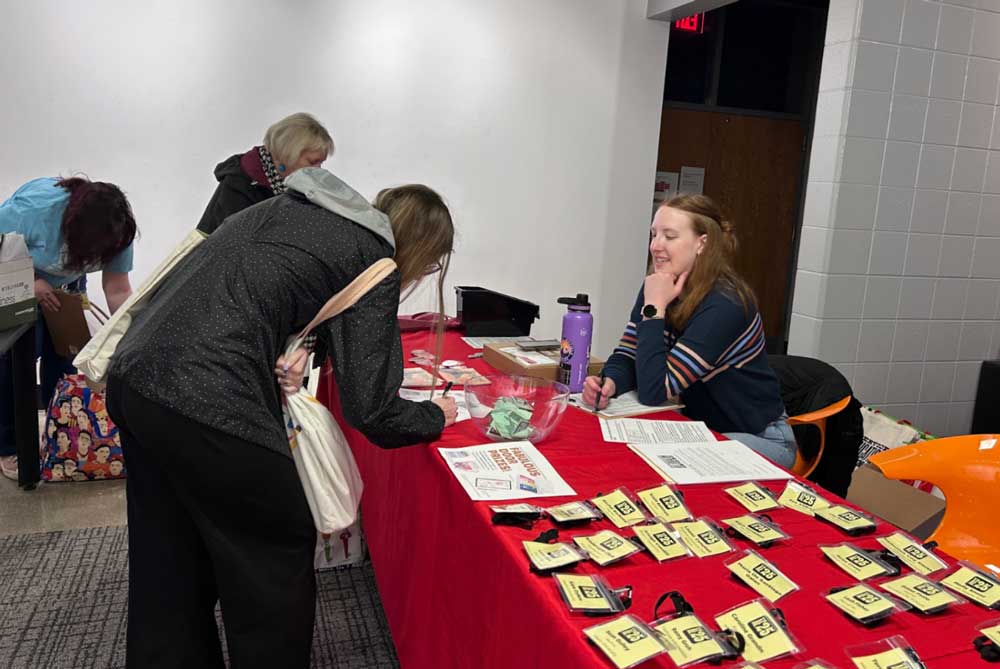 Student volunteers worked in shifts at the registration table, as event photographers, and as tech help, among other roles, to keep the conference running smoothly.