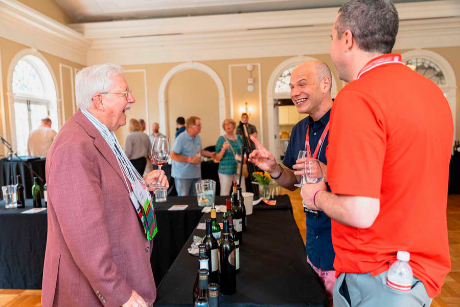 Jack Keegan laughs and talks with two alum.