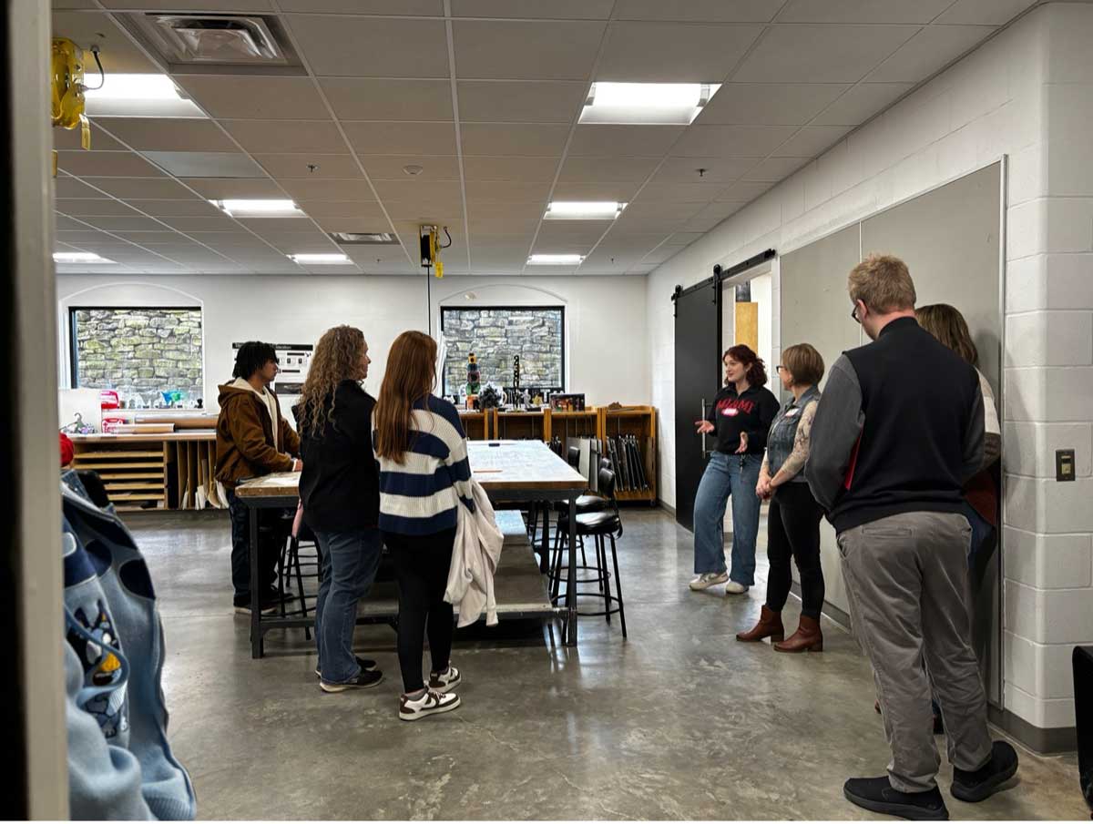 Faculty members, Stephanie Danker and Ellen Long, and students giving tours of the facilities in the Art Building.
