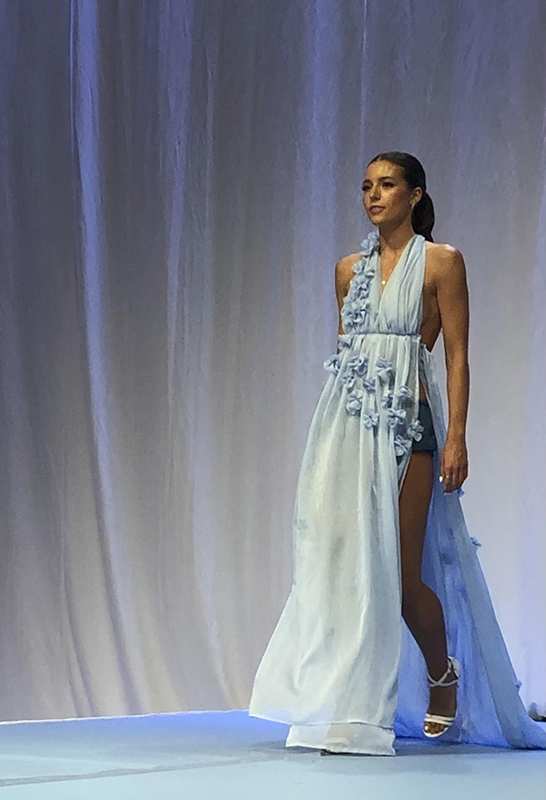 a student walking a runway