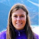 Headshot of a young woman with long brown hair 