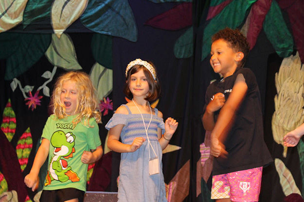 Campers congregate in the lobby of Hall Auditorium to learn lines