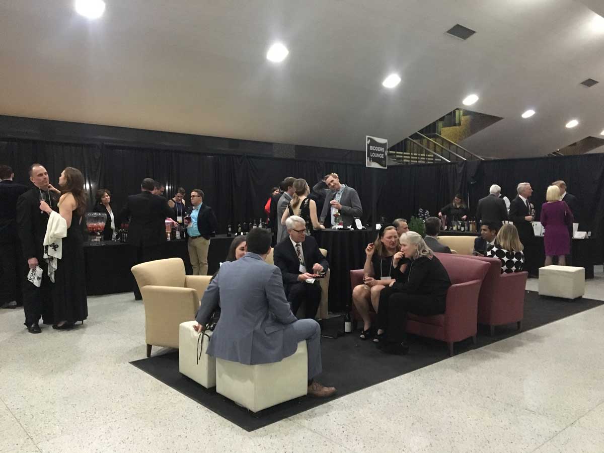 Guests enjoying wine in a seated area