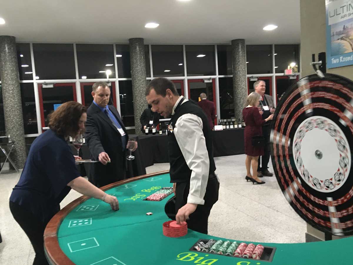 attendees playing a Big Six casino game