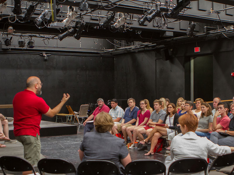 parents and prospective students enjoy a session with a theatre professor in studio 88