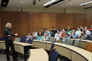Dr. Kathleen Buse speaking in front of her audience