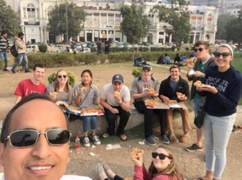 Students and Dr. Shukla Eat Dominos in India