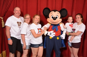 Amelia and her family with Mickey Mouse