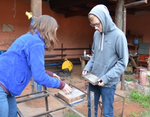 Cameron Burgess and Maddie Spurlock test strength of stove wing design