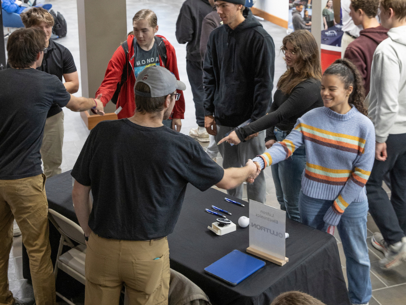Students interacting with industry employers