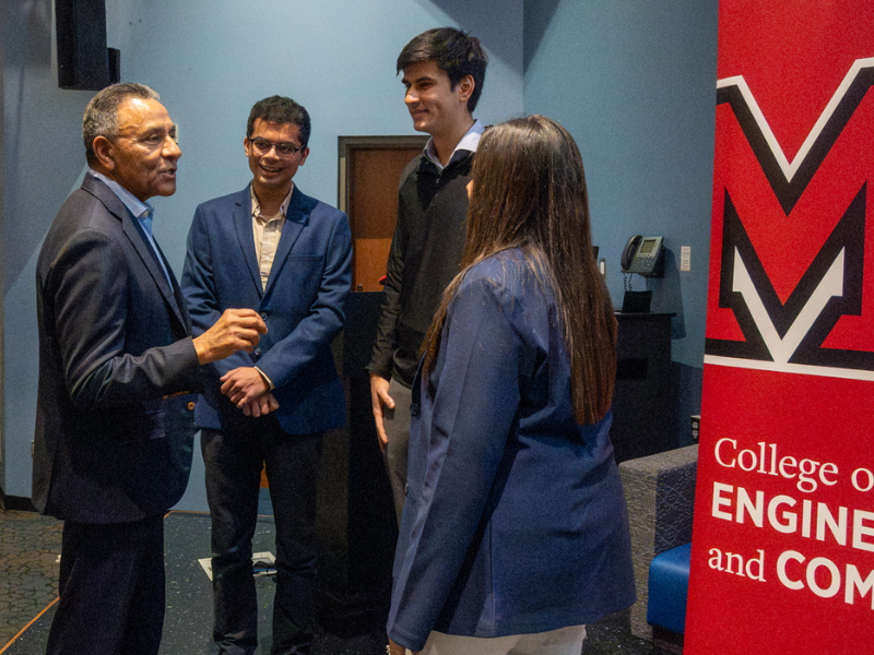 Dinesh Paliwal speaking with CEC students