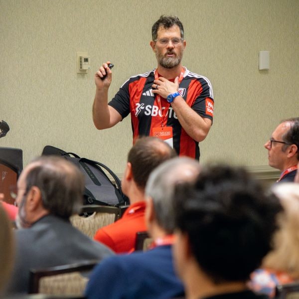 Conference speaker talking to a group
