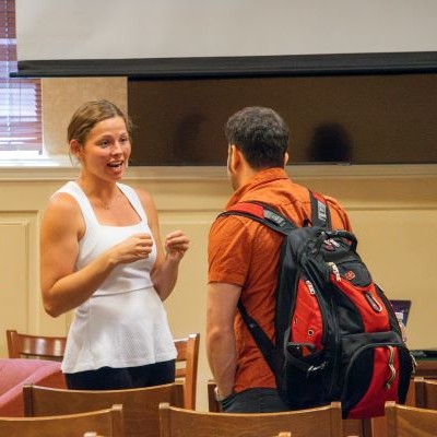 Two students talking at a break