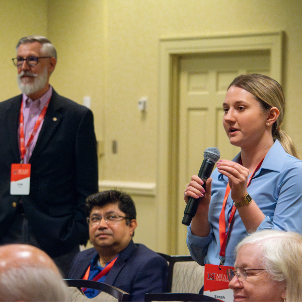 Conference attendee participating in a session