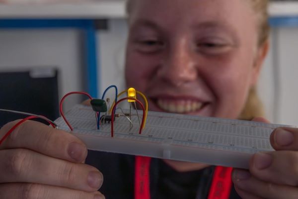 Female student working on a robotics project