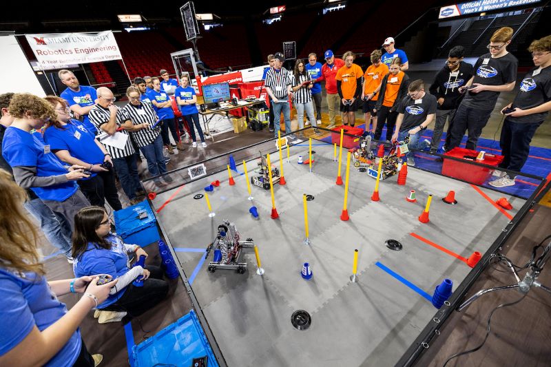 CEC students demonstrating robots at the First Tech conference