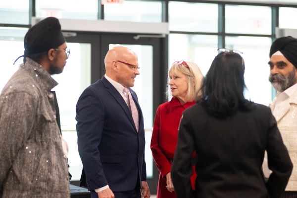 Miami President Greg Crawford talks with students about their projects.