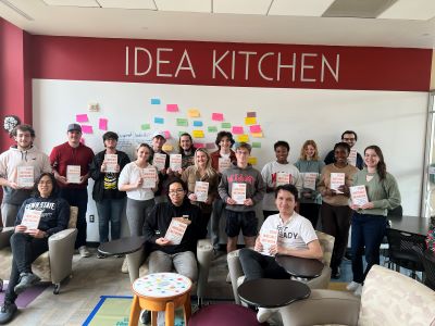 Students from cohort 11 posing in the Idea Kitchen