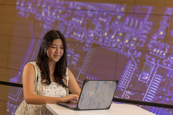 student working at a computer