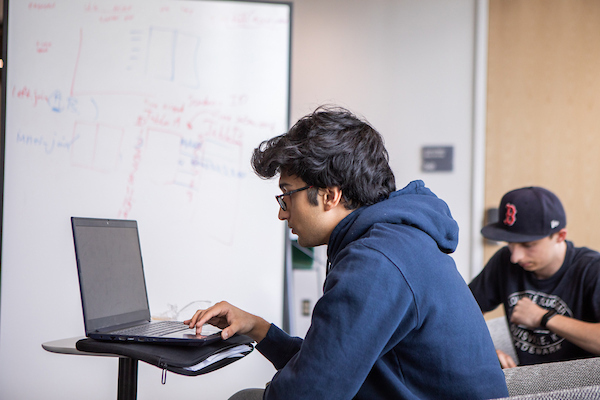 student working at a computer
