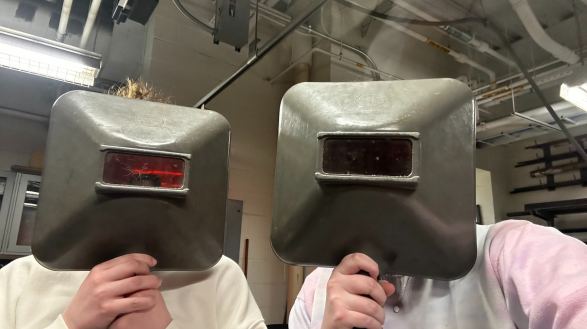 CEC students wear protective welding masks.