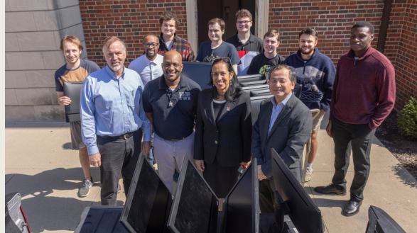 Members of the Miami University HYPE student organization stand with representatives from NCUS with refurbished computers.