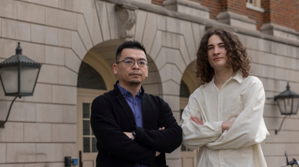 Serhii Reznichenko stands with Shijie Zhou, Ph.D. outside of Hughes Hall on the Miami University campus in Oxford, Ohio.
