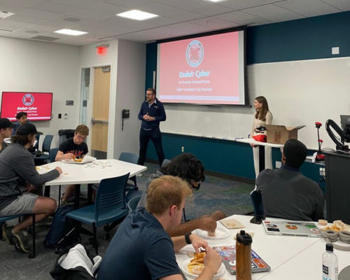 Michael Picton and Lily Teuscher share insights with members of the Cybersecurity Club.