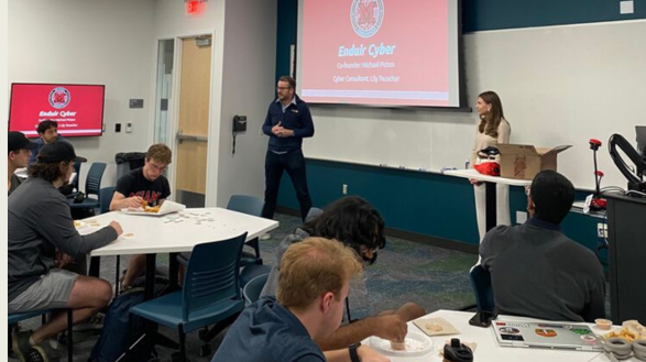 Michael Picton and Lily Teuscher share insights with members of the Cybersecurity Club.
